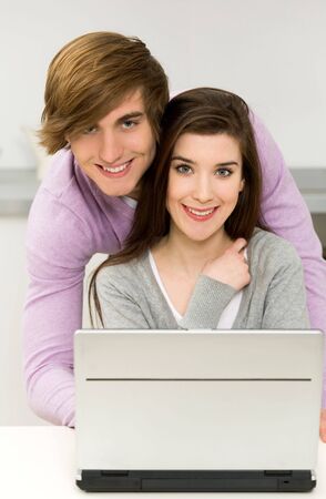 Young couple using laptop の写真素材