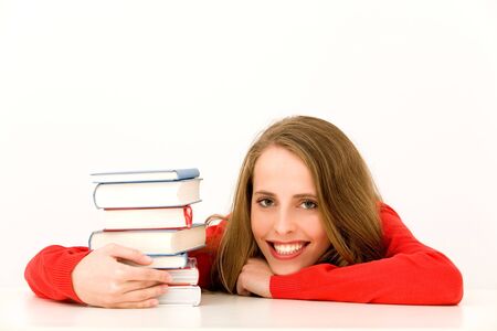 Smiling Woman with Stack of Booksの写真素材