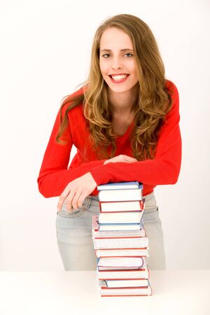 Smiling Woman with Stack of Booksの写真素材