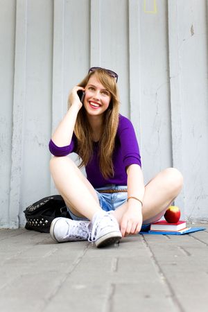 Teenage girl sittingの写真素材