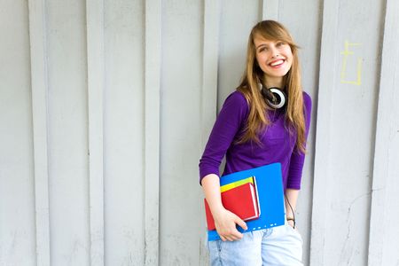 Female student holding booksの写真素材