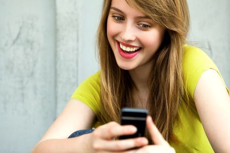Girl with her mobile phoneの写真素材