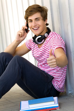 Male student with thumbs upの写真素材