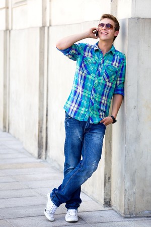 Young man using mobile phoneの写真素材