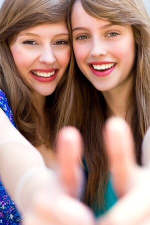 Girls with thumbs upの写真素材