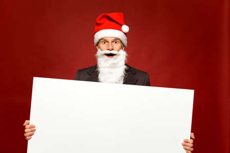 Santa holding blank posterの写真素材