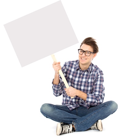 Young man holding blank posterの写真素材