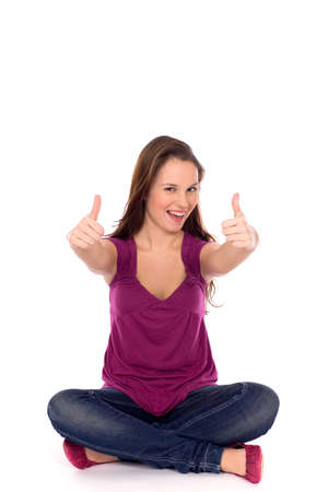 Girl showing thumbs upの写真素材