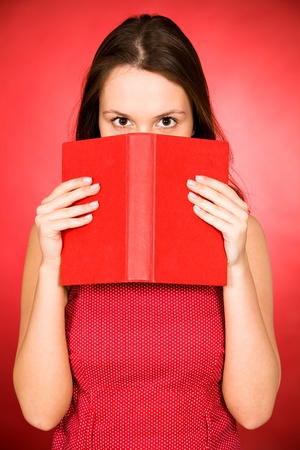 Woman holding bookの写真素材