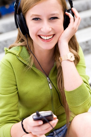 Girl with mp3 playerの写真素材