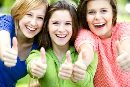 Friends with thumbs upの写真素材