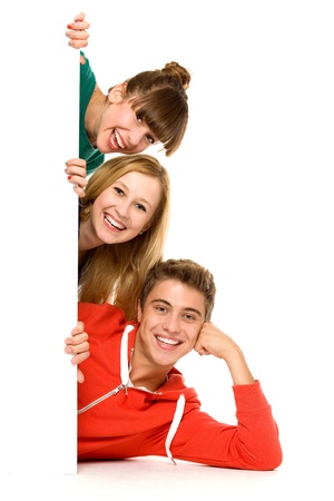 Friends holding blank poster Friends holding blank poster