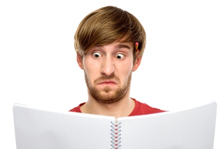 Man reading something looking surprised