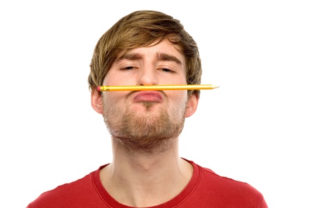 Amusing man with pencil above mouthの写真素材