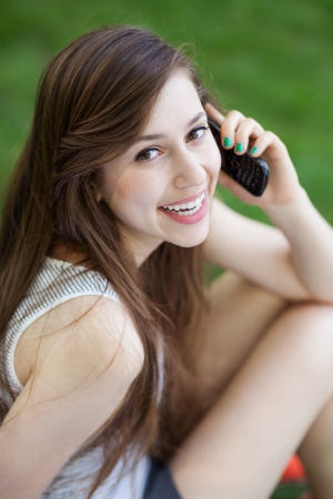 Young woman using mobile phoneの写真素材