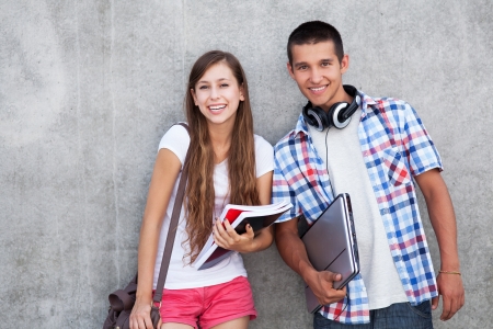 Students holding their booksの写真素材