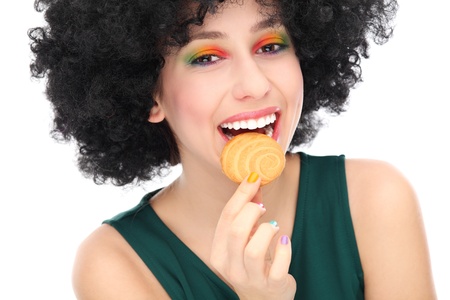 Woman eating cookieの写真素材