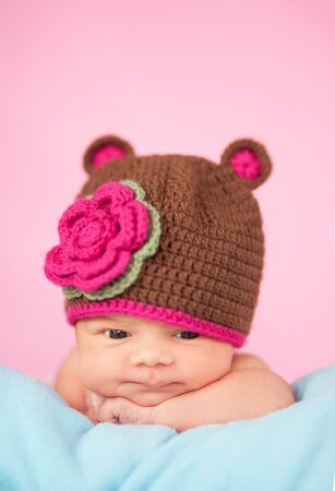 Newborn in knitted hatの写真素材