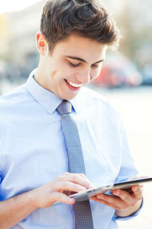 Young man holding digital tabletの写真素材