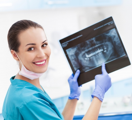 Female dentist with x-ray pictureの写真素材