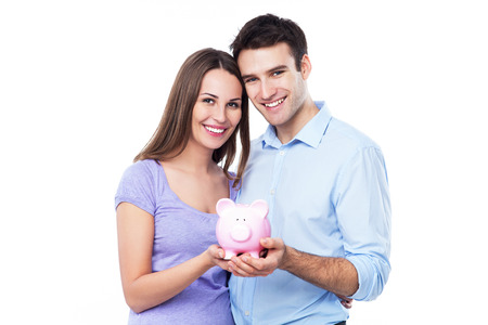 Couple holding piggy bankの写真素材