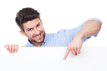 Man pointing at blank signの写真素材