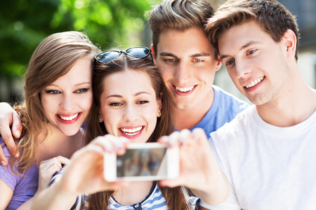 Friends taking photo of themselves