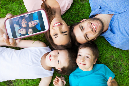 Family taking picture of themselvesの写真素材