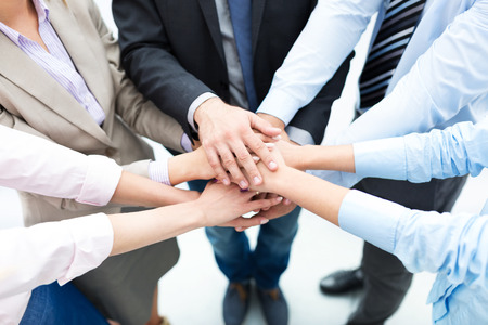 Business people joining hands in circle Business people joining hands in circle