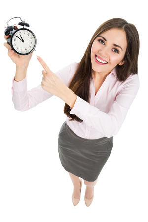 Woman holding clockの写真素材