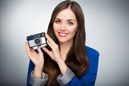 Beautiful woman with vintage camera
