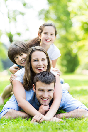 Family of four in the parkの写真素材