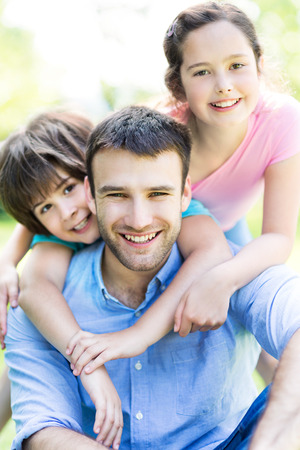 Father with two childrenの写真素材
