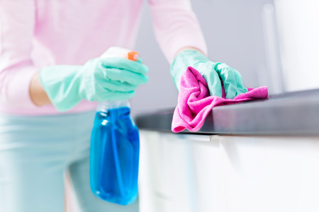 Woman Cleaning Kitchen Counterの写真素材