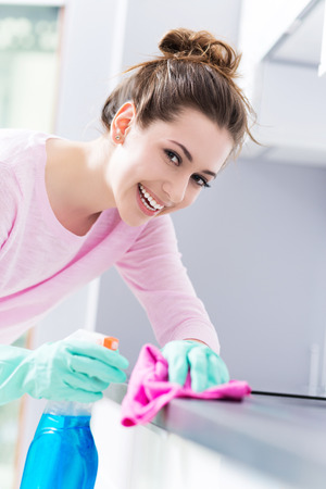 Woman Cleaning Kitchen Counterの写真素材