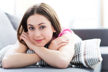 Woman relaxing on sofaの写真素材