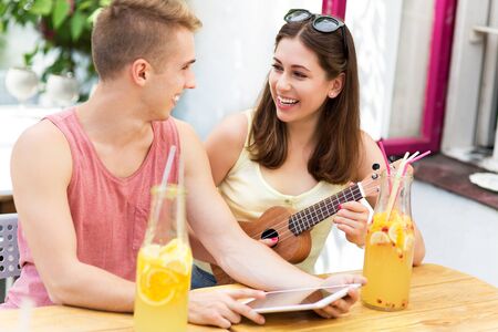 Young couple at outdoor cafeの写真素材