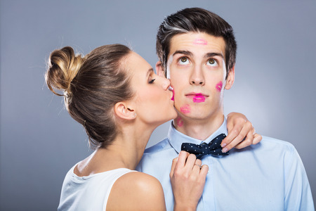 Young woman kissing man Young woman kissing man