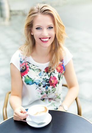 Woman at outdoor cafeの写真素材