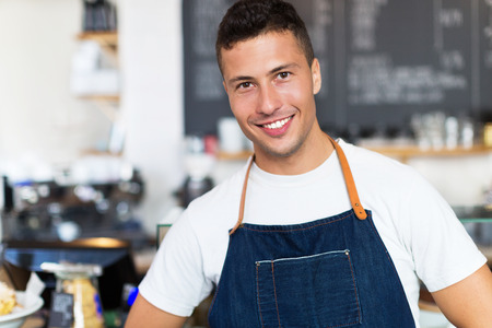 Man working in a coffee shopの写真素材