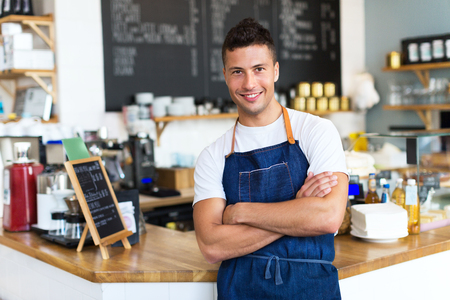 Man working in a coffee shopの写真素材