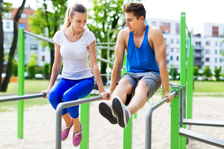 Young couple training outdoorsの写真素材