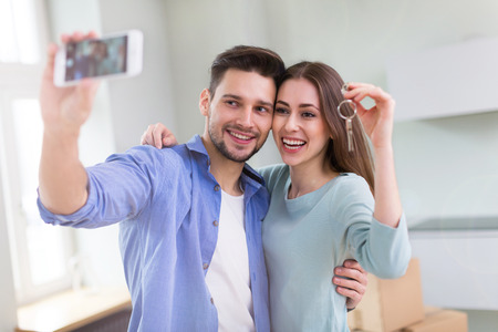 Couple with keys to new homeの写真素材