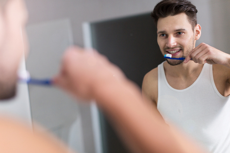man brushing teethの写真素材