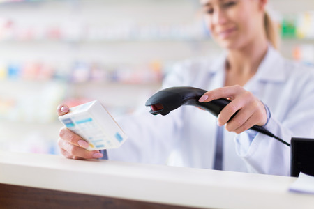 Pharmacist scanning productの写真素材