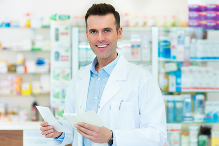 Pharmacist filling prescription in pharmacyの写真素材