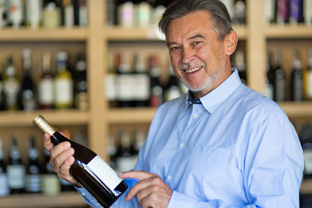 Man choosing wineの写真素材