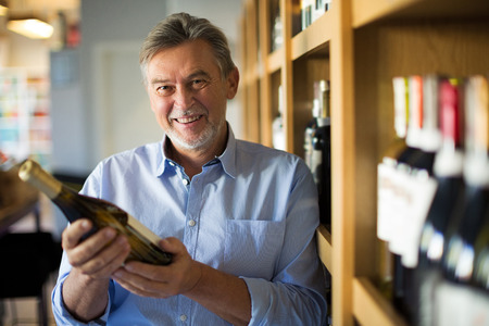 Man choosing wineの写真素材