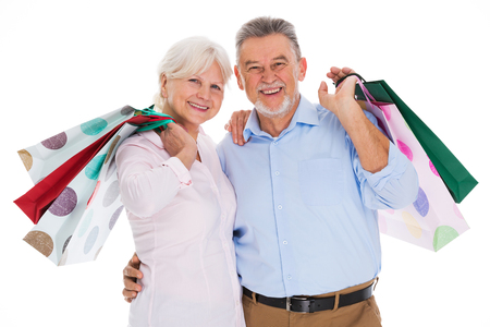 Senior couple holding shopping bagsの写真素材