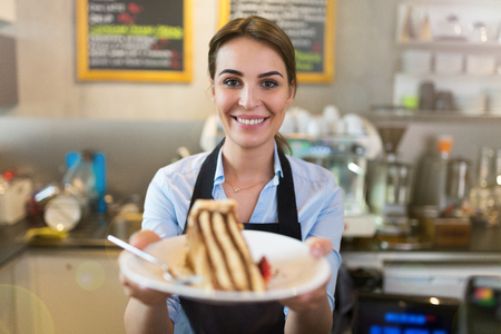 Small business owner standing in a coffee shopの写真素材